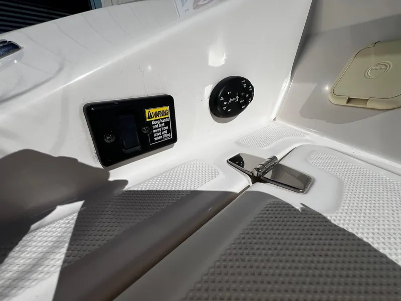 Slide: The Image of Close-up of control panel and warning label on 2004 Regal 2200 Bowrider boat. - 27