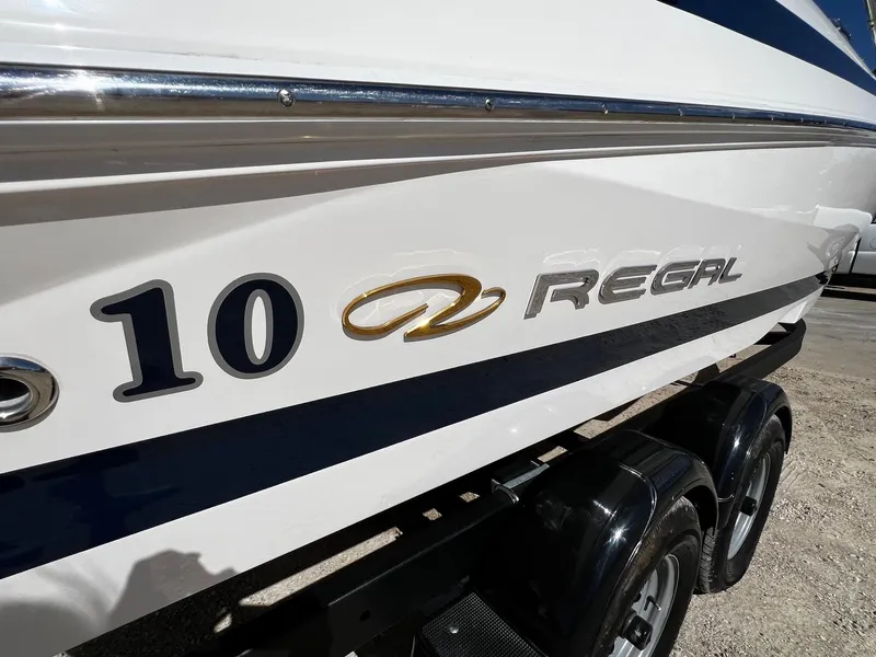 Slide: The Image of Close-up of 2004 Regal 2200 Bowrider boat with model name and number. - 29