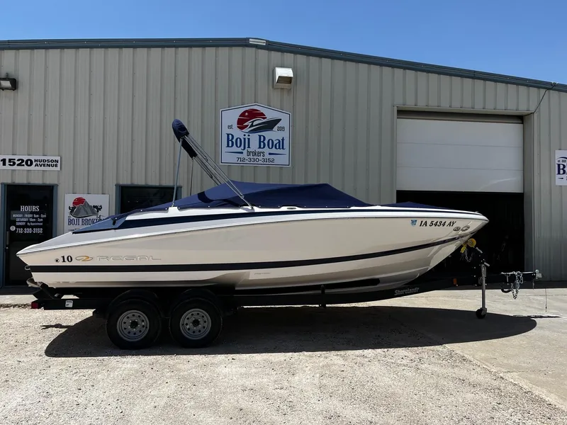 Slide: The Image of 2004 Regal 2200 Bowrider boat on trailer outside Boji Boat Brokers. - 30