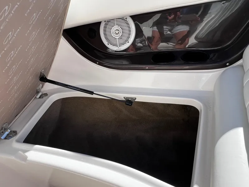 Slide: The Image of Open storage compartment in a 2004 Regal 2200 Bowrider boat. - 8