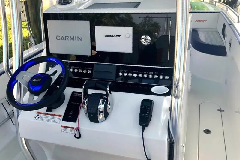 Slide: The Image of Control console of a 2020 Concept 36' Cuddy Cabin boat with Garmin and Mercury systems. - 4
