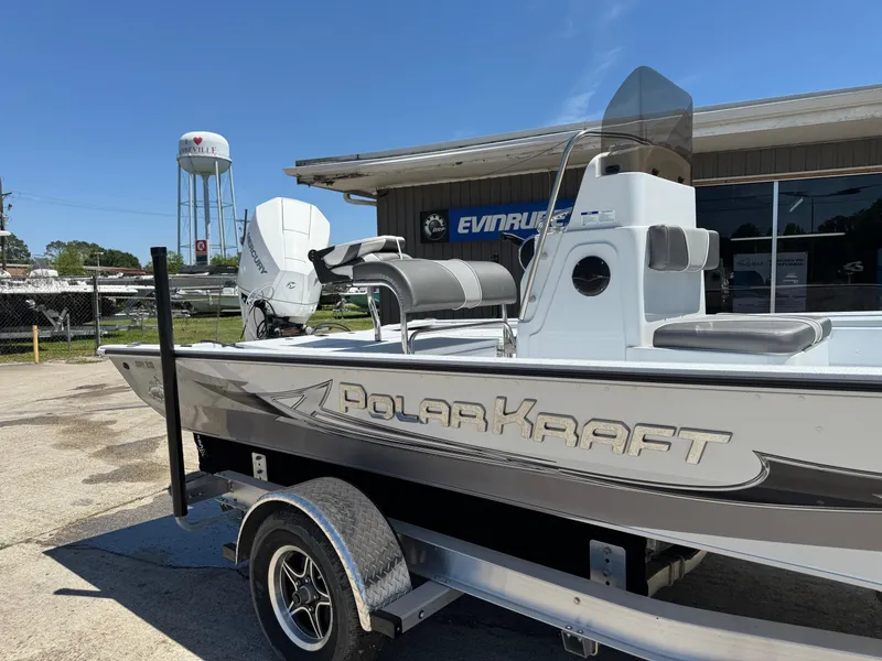 The Image of 2023 Polar Kraft BAY210CC boat on trailer outside dealership. - 0