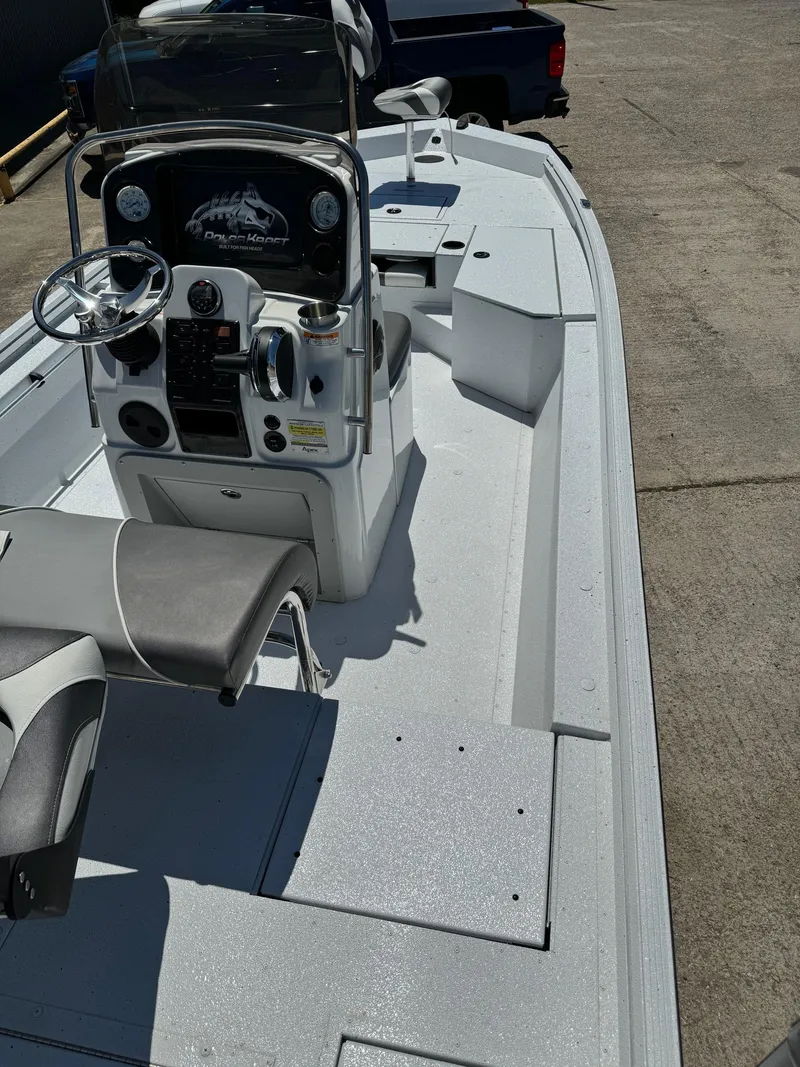 Slide: The Image of 2023 Polar Kraft BAY210CC boat interior with console and seating. - 10