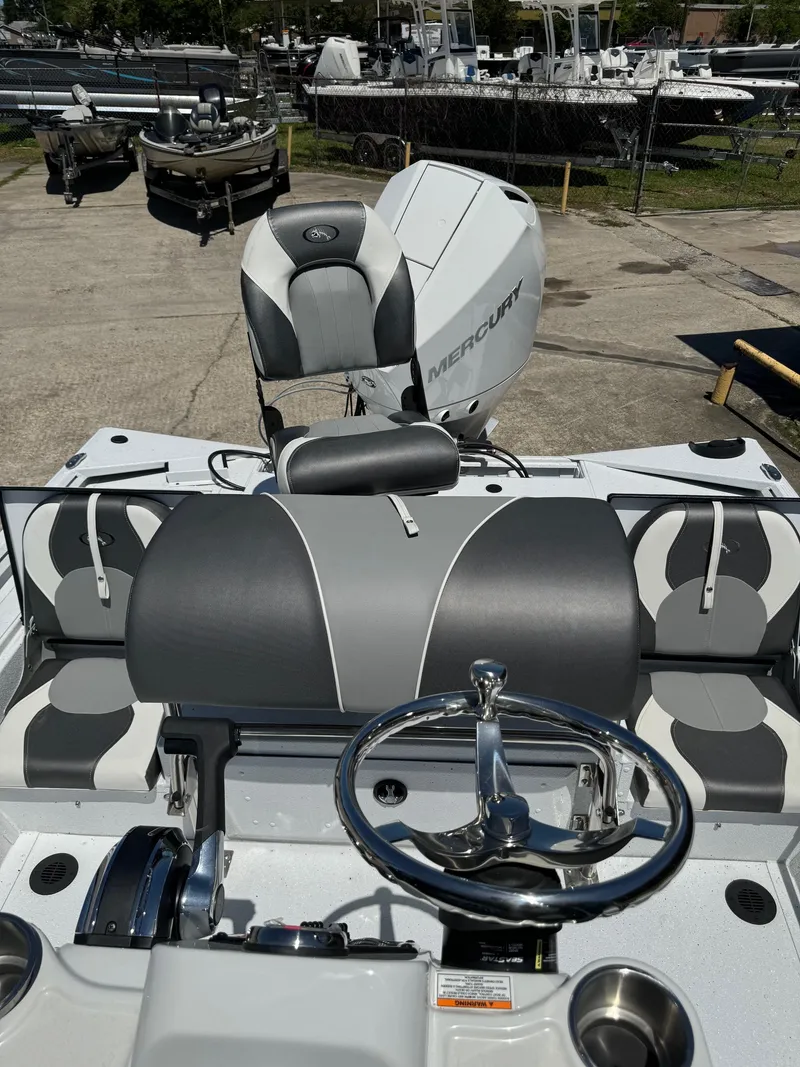 Slide: The Image of 2023 Polar Kraft BAY210CC boat with Mercury engine, interior view. - 8