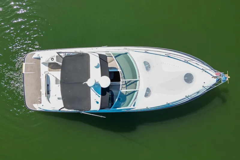 Slide: The Image of 2008 Cruisers Yachts 330 Express boat aerial view on green water. - 15
