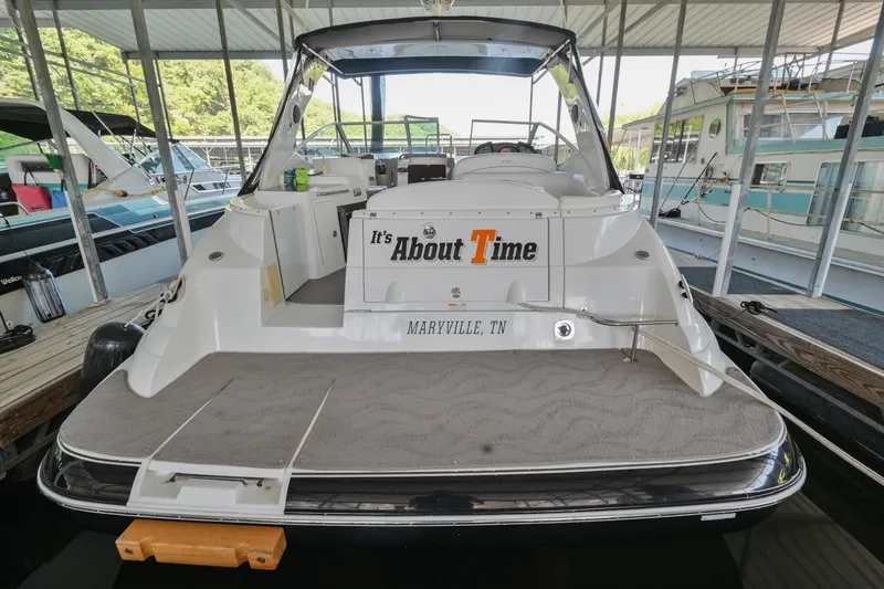 Slide: The Image of 2008 Cruisers Yachts 330 Express docked, rear view with It's About Time name. - 16