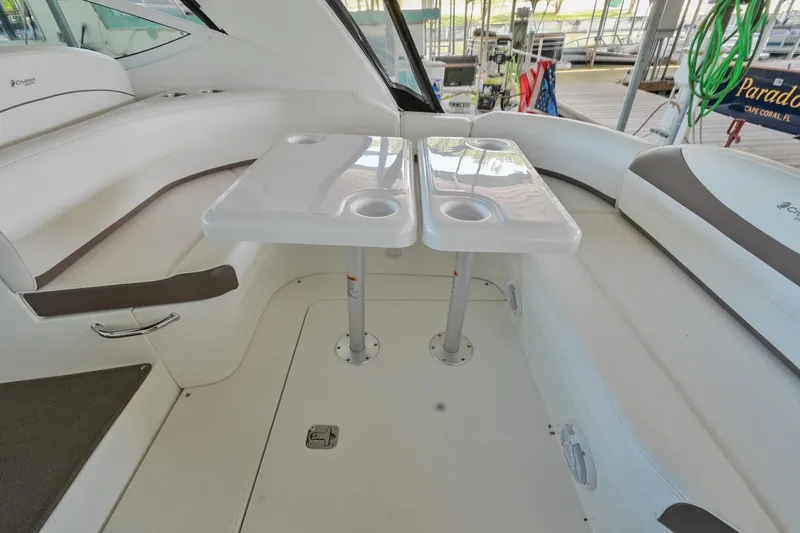 Slide: The Image of 2008 Cruisers Yachts 330 Express interior seating area with dual tables. - 24