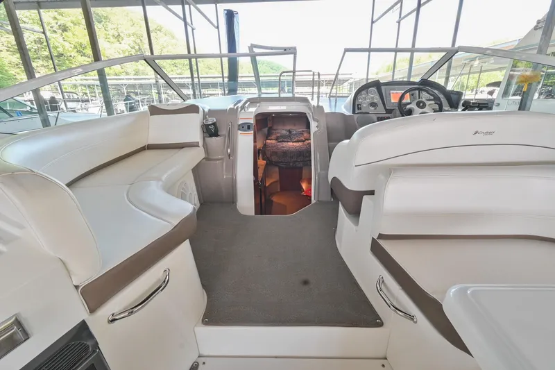 Slide: The Image of 2008 Cruisers Yachts 330 Express interior with seating and helm station. - 26