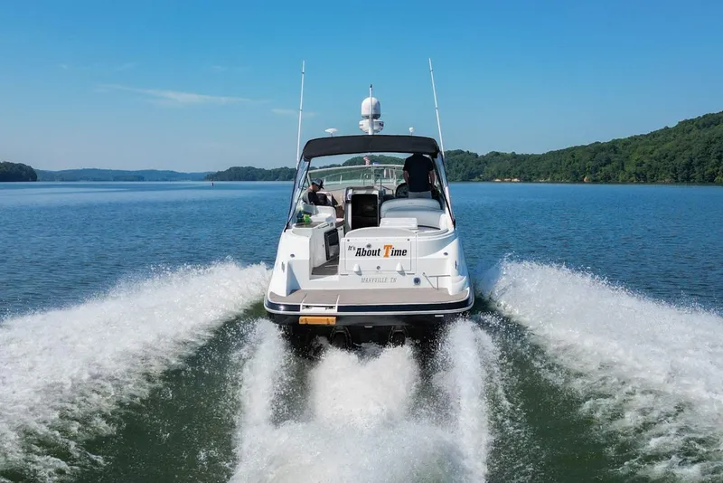 Slide: The Image of 2008 Cruisers Yachts 330 Express speeding on a lake. - 4