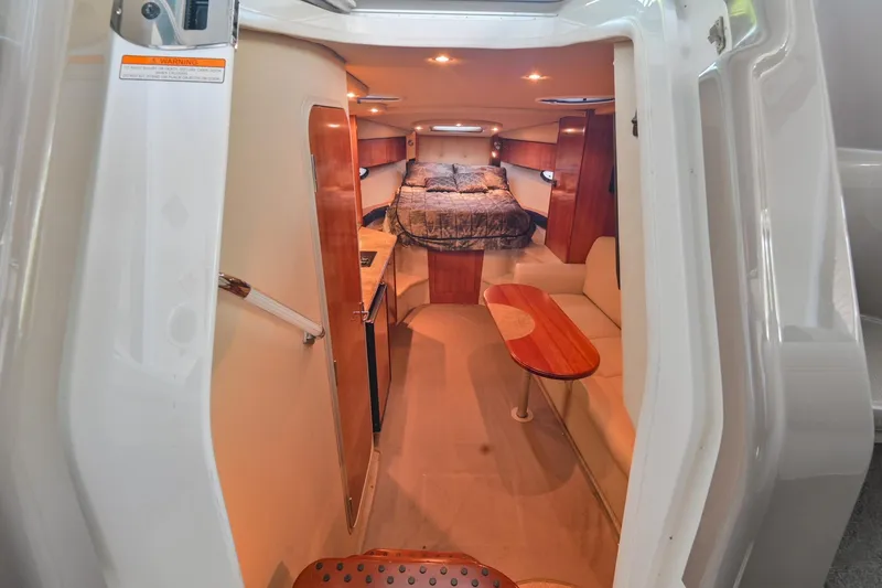 Slide: The Image of Interior cabin of 2008 Cruisers Yachts 330 Express with bed, seating, and table. - 41