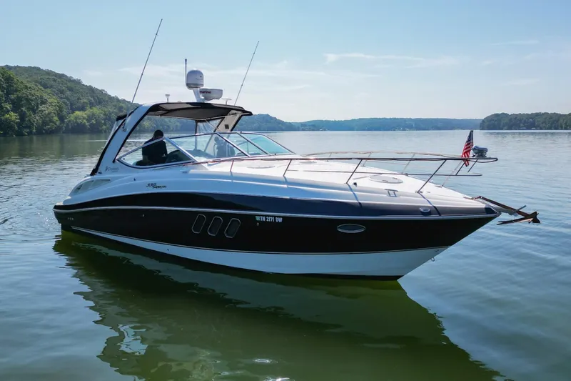 Slide: The Image of 2008 Cruisers Yachts 330 Express on a serene lake. - 10