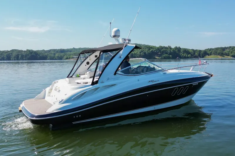 Slide: The Image of 2008 Cruisers Yachts 330 Express on a serene lake. - 12