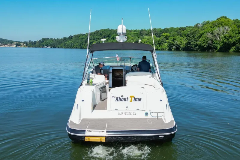 Slide: The Image of 2008 Cruisers Yachts 330 Express on a serene lake. - 13