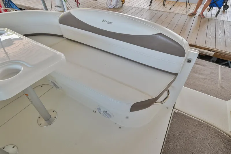 Slide: The Image of 2008 Cruisers Yachts 330 Express boat seating area with table on deck. - 21