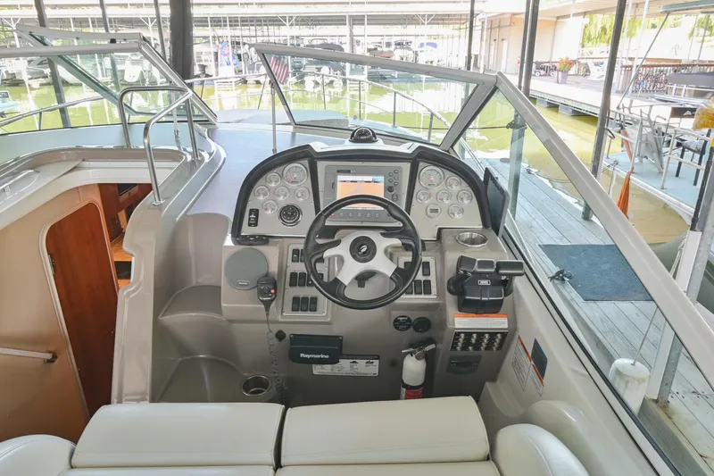 Slide: The Image of 2008 Cruisers Yachts 330 Express helm with modern controls and navigation equipment. - 31