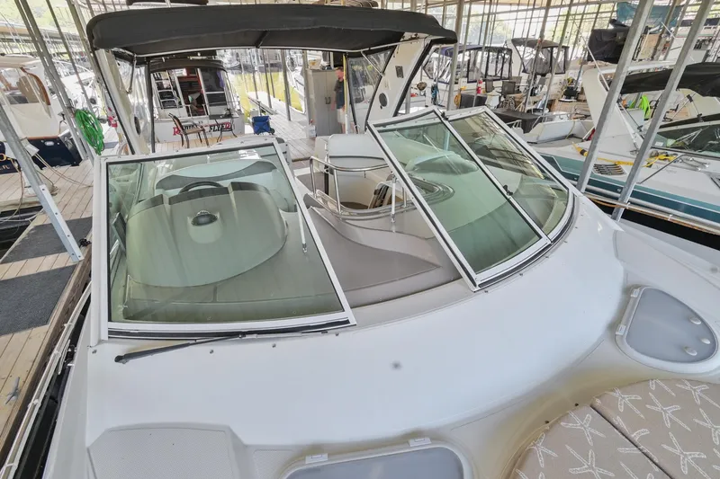 Slide: The Image of 2008 Cruisers Yachts 330 Express boat with open windshield in marina. - 40
