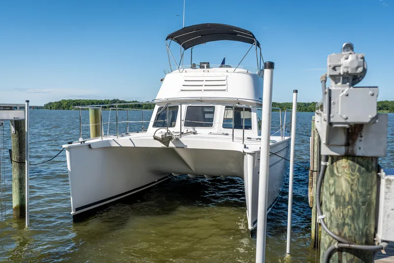 Slide: The Image of 2002 PDQ Power Catamaran MV/34 Passagemaker docked on a sunny day. - 15