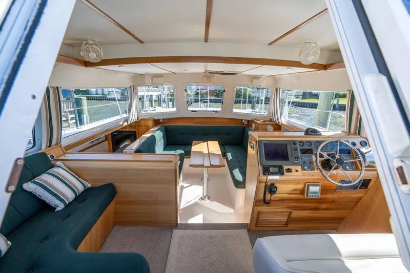 Slide: The Image of Interior of 2002 PDQ Power Catamaran MV/34 Passagemaker with helm, seating, and navigation equipment. - 16