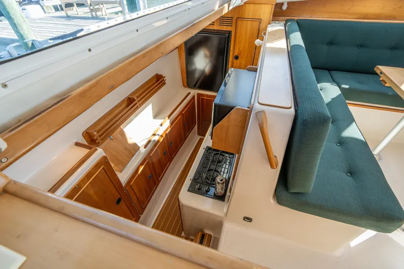 Slide: The Image of Interior of 2002 PDQ Power Catamaran MV/34 Passagemaker with kitchen and seating area. - 21