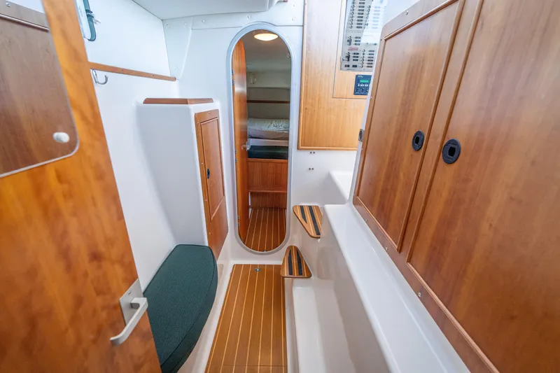 Slide: The Image of Interior of 2002 PDQ Power Catamaran MV/34 Passagemaker with wood paneling and seating. - 29