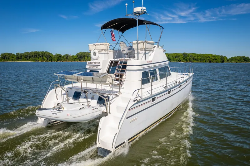 Slide: The Image of 2002 PDQ Power Catamaran MV/34 Passagemaker cruising on a sunny day. - 3
