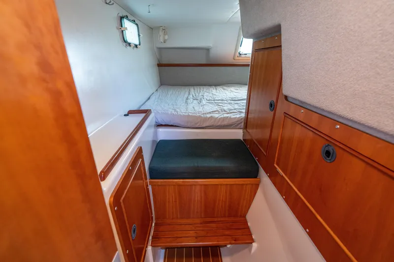 Slide: The Image of Cozy cabin interior of 2002 PDQ Power Catamaran MV/34 Passagemaker with wooden accents. - 30