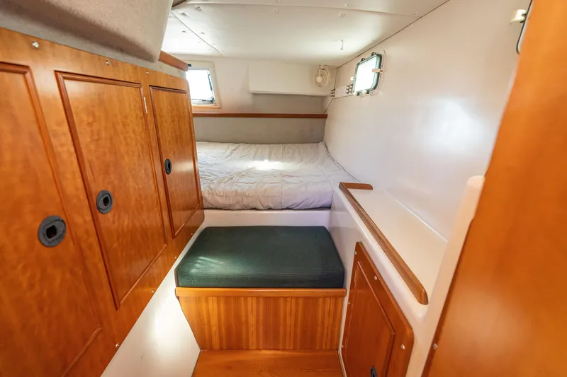 Slide: The Image of Cozy cabin interior of 2002 PDQ Power Catamaran MV/34 Passagemaker with wooden storage cabinets. - 37