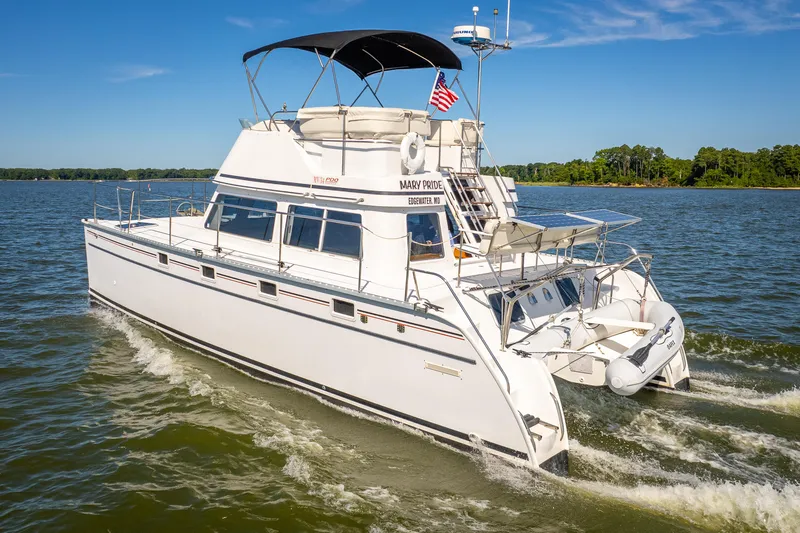 Slide: The Image of 2002 PDQ Power Catamaran MV/34 Passagemaker cruising on a sunny day. - 4