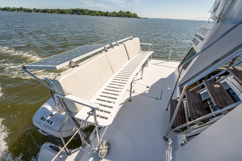 Slide: The Image of 2002 PDQ Power Catamaran MV/34 Passagemaker with solar panels and seating on deck. - 44