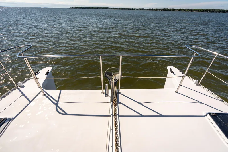 Slide: The Image of Bow view of 2002 PDQ Power Catamaran MV/34 Passagemaker on open water. - 45