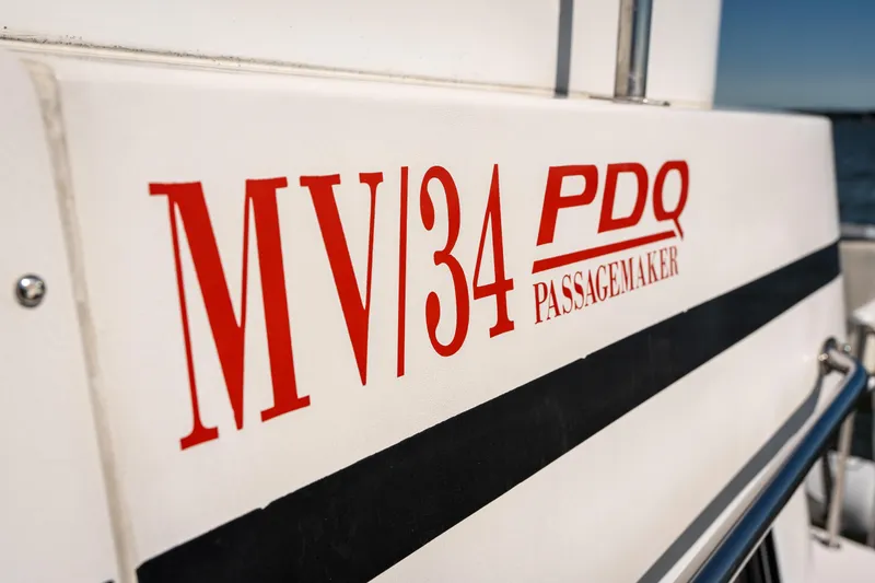 Slide: The Image of Close-up of 2002 PDQ Power Catamaran MV/34 Passagemaker boat name. - 50