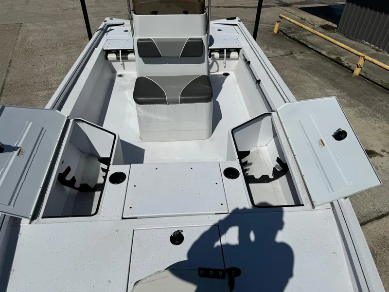 Slide: The Image of 2023 Polar Kraft BAY210CC boat interior with open storage compartments. - 10