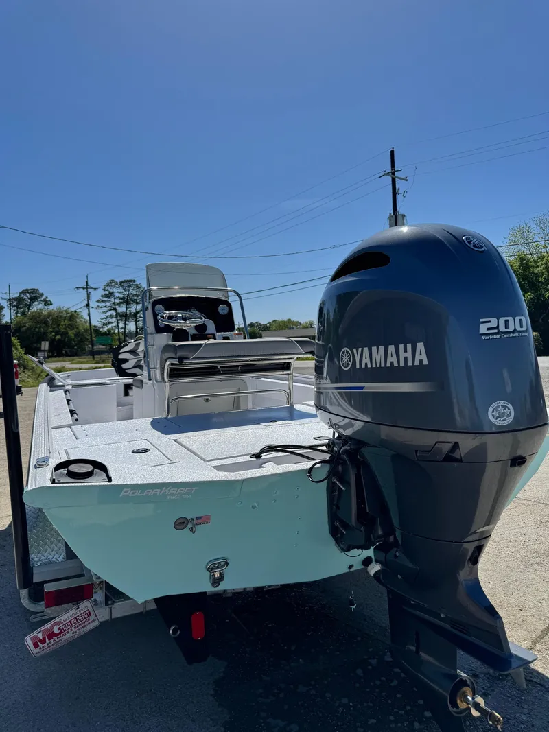 Slide: The Image of 2023 Polar Kraft BAY210CC boat with Yamaha 200 outboard motor. - 2
