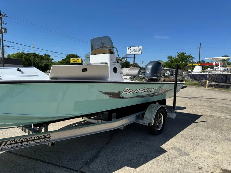 Slide: The Image of 2023 Polar Kraft BAY210CC boat on a McClain trailer in a parking lot. - 3