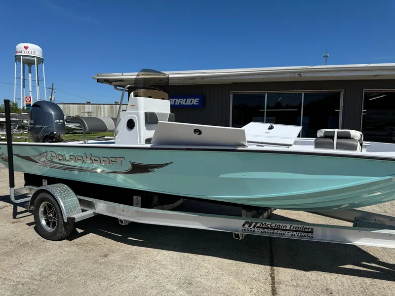 Slide: The Image of 2023 Polar Kraft BAY210CC boat on a trailer outside a dealership. - 5