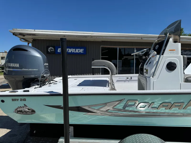 Slide: The Image of 2023 Polar Kraft BAY210CC boat with Yamaha engine outside Evinrude dealership. - 6