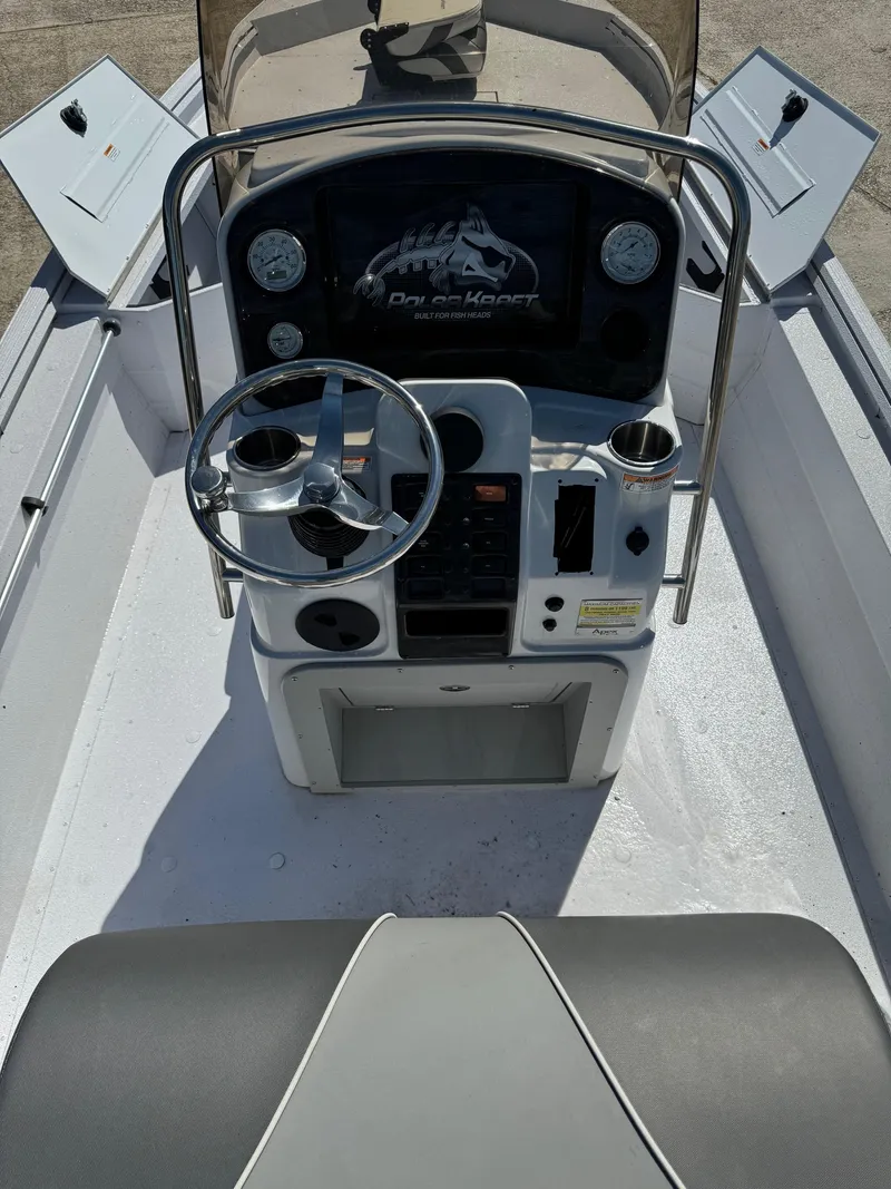 Slide: The Image of 2023 Polar Kraft BAY210CC boat console with steering wheel and controls. - 7