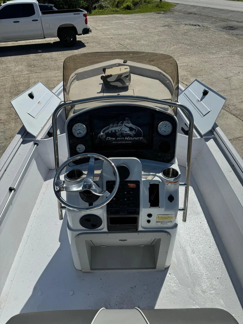 Slide: The Image of 2023 Polar Kraft BAY210CC boat console with steering wheel and controls. - 8
