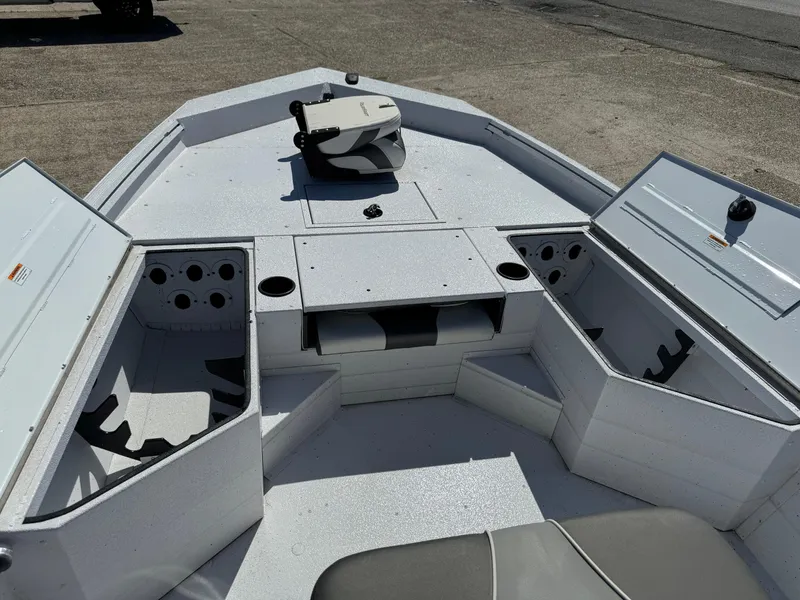 Slide: The Image of 2023 Polar Kraft BAY210CC boat interior with storage compartments and seating. - 9
