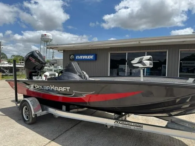 The Image of 2023 Polar Kraft 195 Pro boat on trailer outside Evinrude dealership. - 0