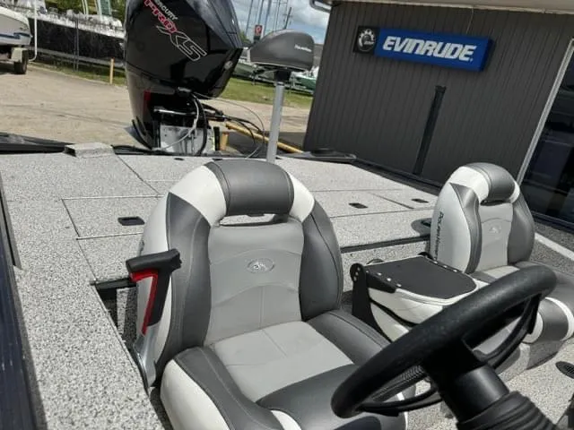 Slide: The Image of 2023 Polar Kraft 195 Pro boat interior with seats and Evinrude motor. - 3