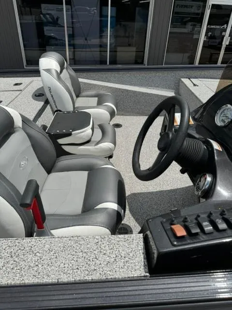 Slide: The Image of 2023 Polar Kraft 195 Pro boat interior with steering wheel and seating. - 4