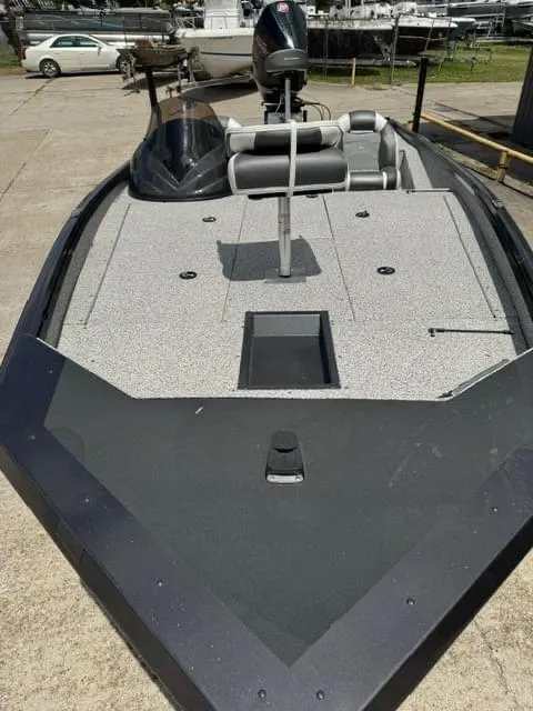 Slide: The Image of 2023 Polar Kraft 195 Pro fishing boat, front deck view at marina. - 6