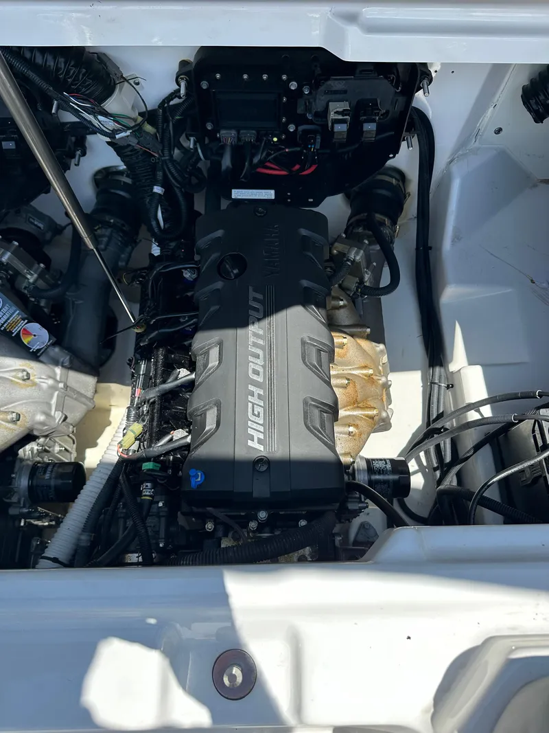 Slide: The Image of 2022 Yamaha Boats SX250 engine compartment with high output engine. - 12