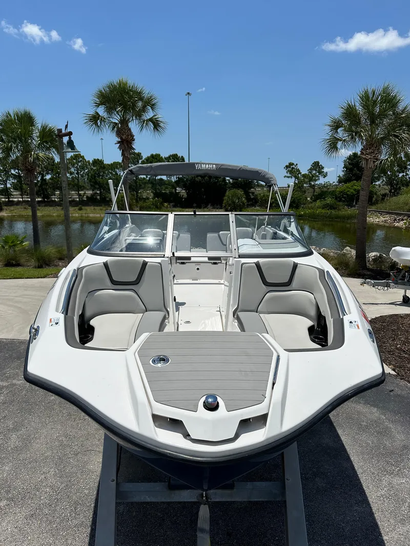 Slide: The Image of 2022 Yamaha Boats SX250 on display, featuring sleek design and spacious seating. - 2