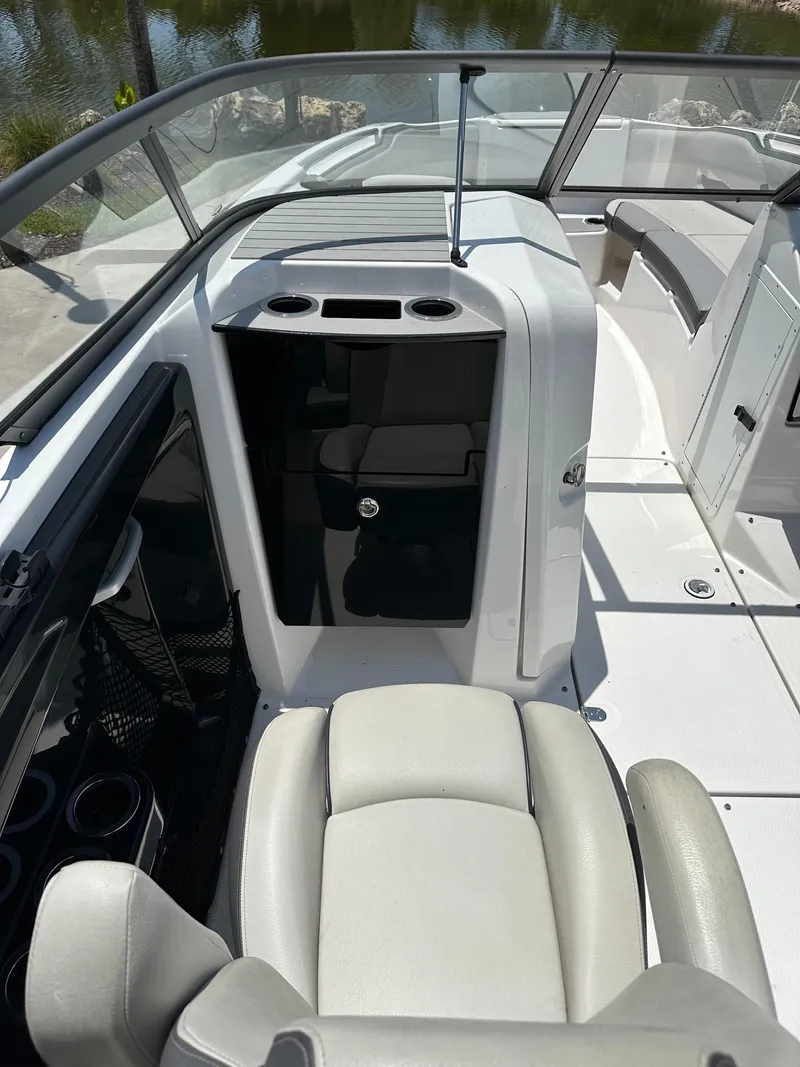Slide: The Image of 2022 Yamaha Boats SX250 interior with seating and storage compartments. - 22