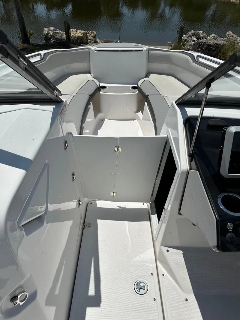 Slide: The Image of 2022 Yamaha Boats SX250 interior view with seating and open deck. - 7
