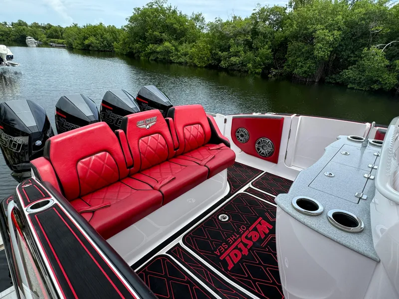 Slide: The Image of Luxury Deep Impact 399 boat with red seating, powerful engines, and sleek design, 2022 model. - 11
