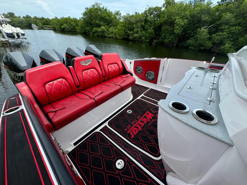Slide: The Image of Luxury Deep Impact 399 boat interior with red seating and sleek design, 2022 model. - 13
