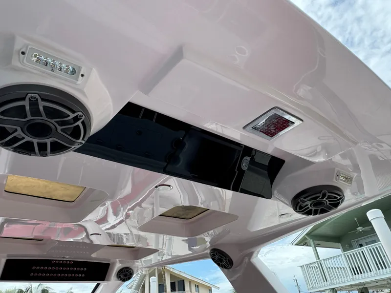 Slide: The Image of Interior view of 2022 Deep Impact 399 boat ceiling with speakers and lights. - 26